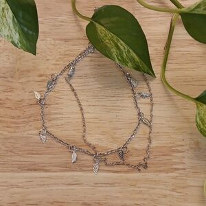 Two silver ankle chains